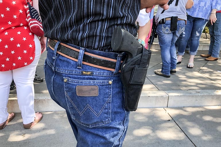 open carry pistol revolver in holster