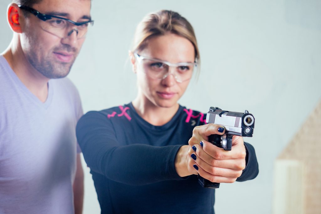 Woman gun range training practice Bigstock