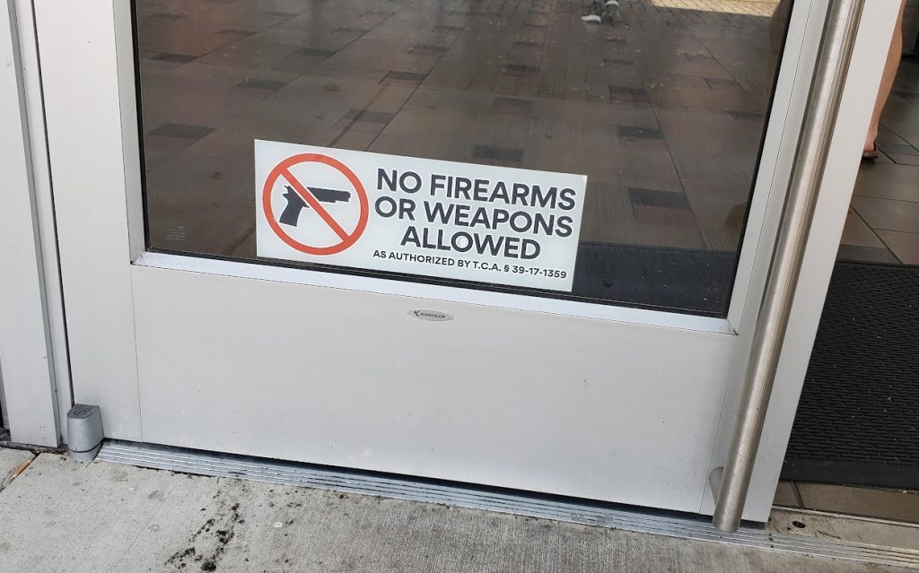 No guns door sign gun-free zone