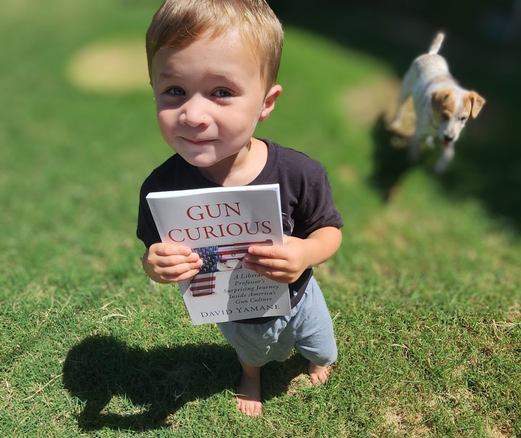 little boy with book