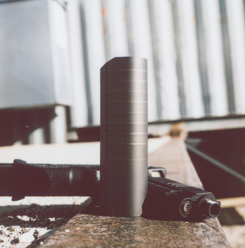 titanium suppressor with handgun