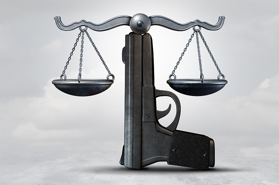 gun law scale of justice court judge DOJ department of justice bigstock