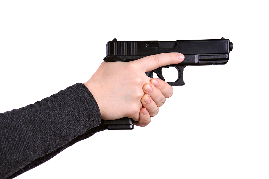 woman's hand glock pistol bigstock