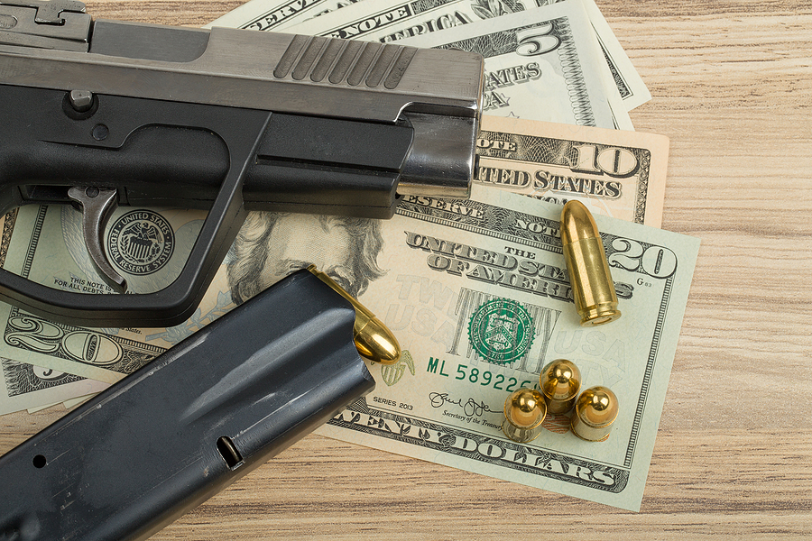 gun pistol cash money dollars bigstock