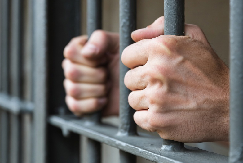 hands jail cell bars grok