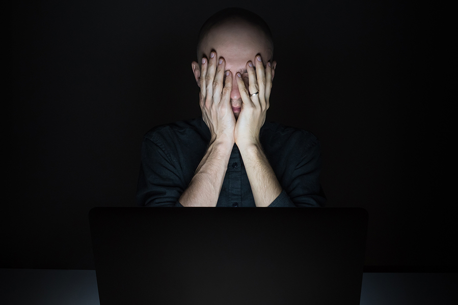 man computer screen facepalm hands face bigstock
