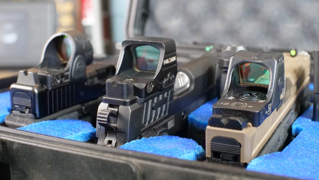 Pistols in case red dot sights