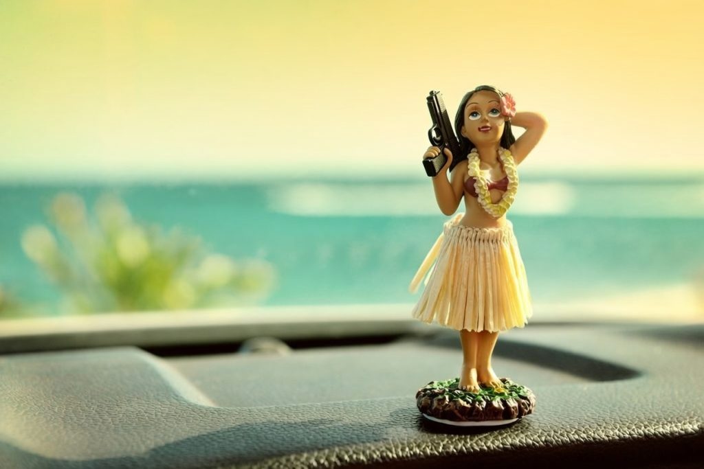 hawaii hula girl dashboard with gun Bigstock Grok
